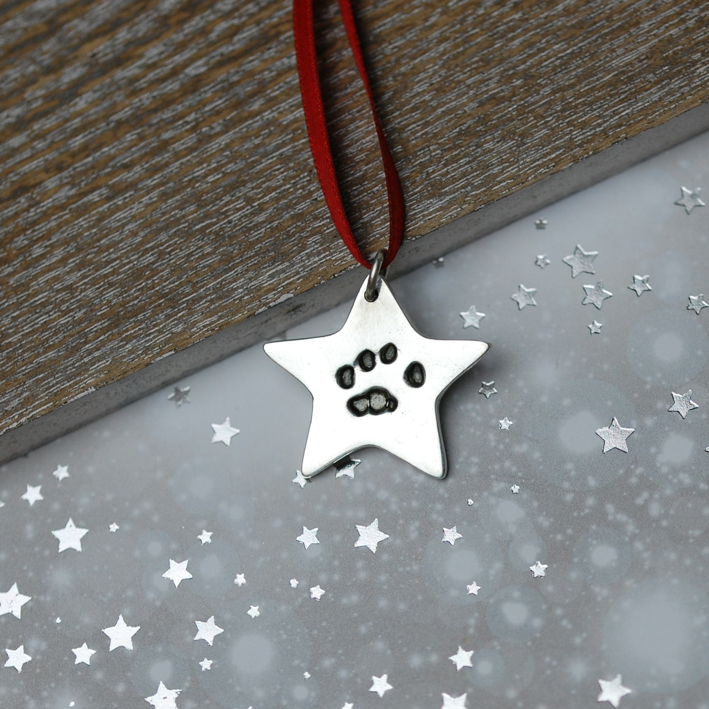 Sterling silver star decoration with your pet's unique paw print
