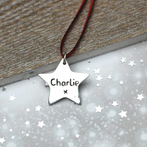 Inscription on the back of a personalised silver Christmas decoration
