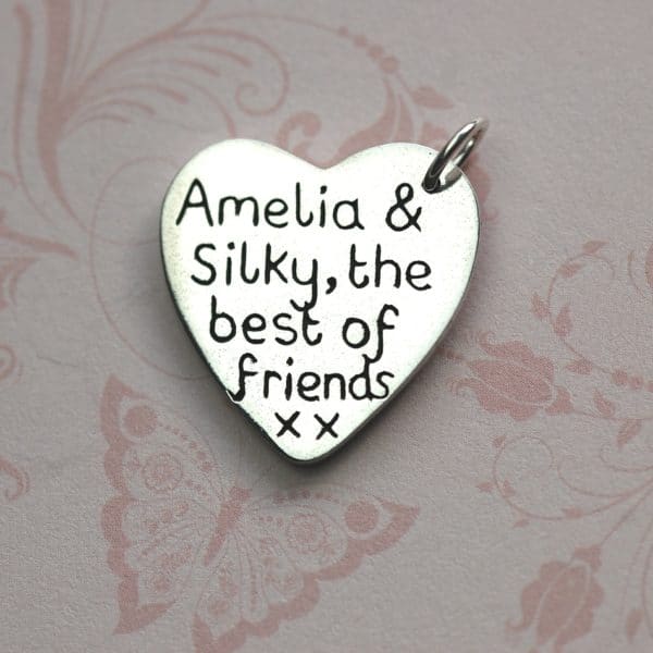 Inscription on the back of large paw print charm