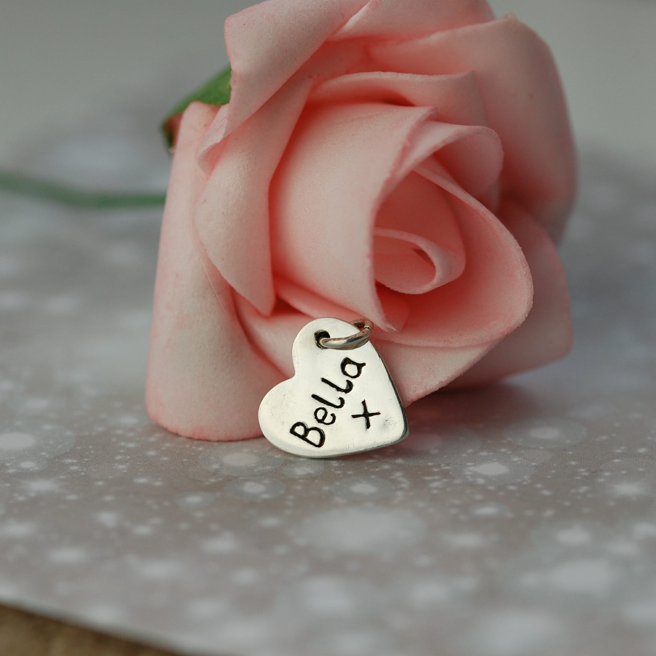 Inscription on the back of small paw print charm
