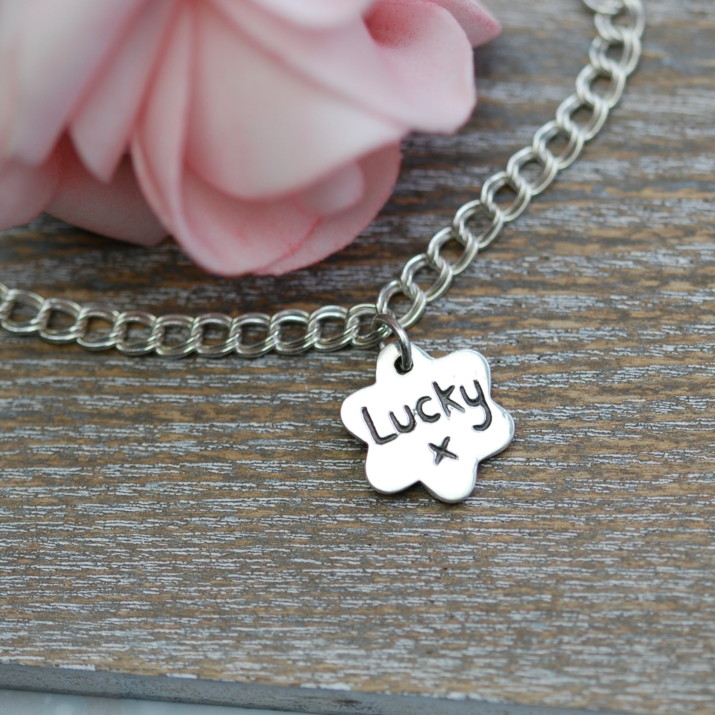 Inscription on the back of small paw print charm