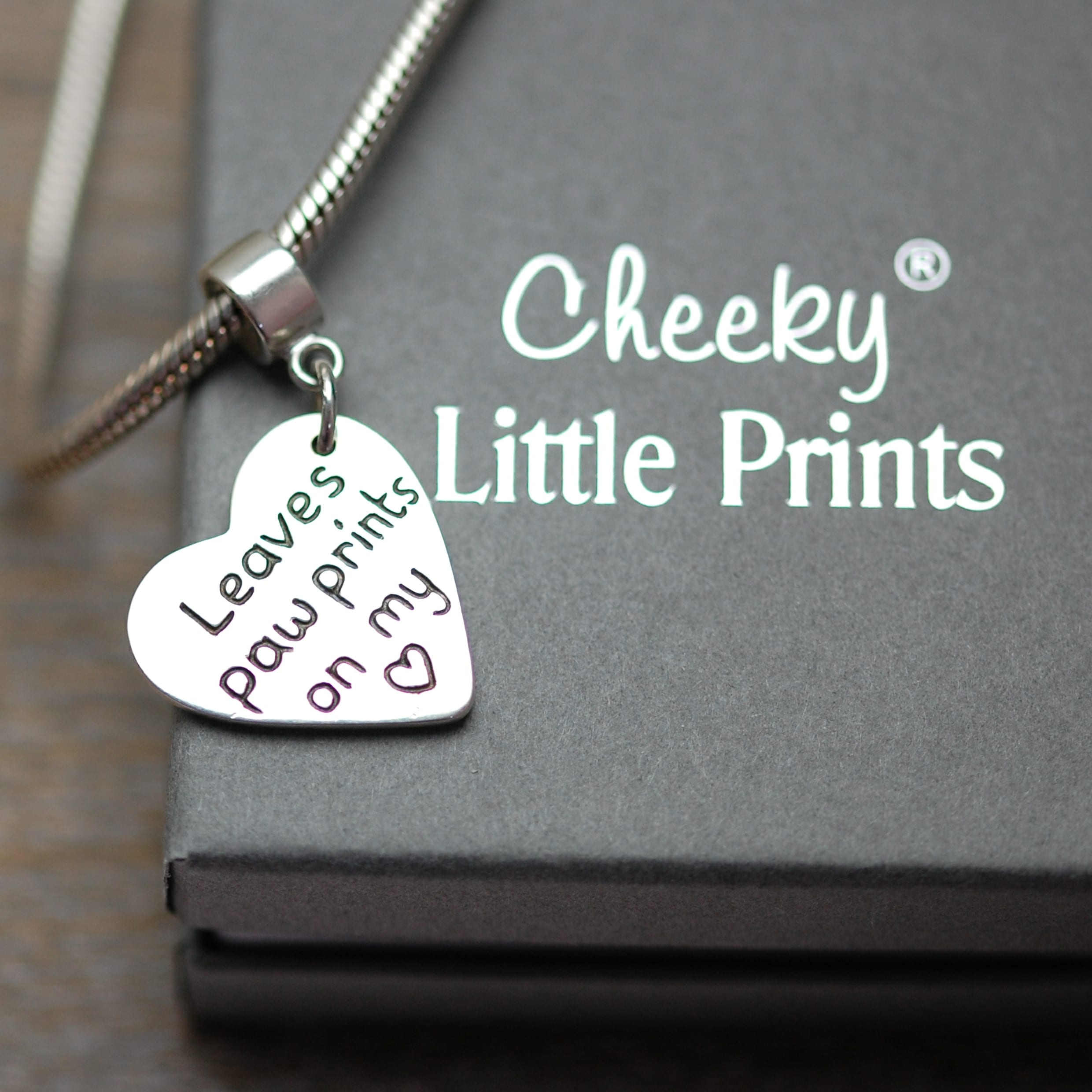 Inscription on the back of paw print charm