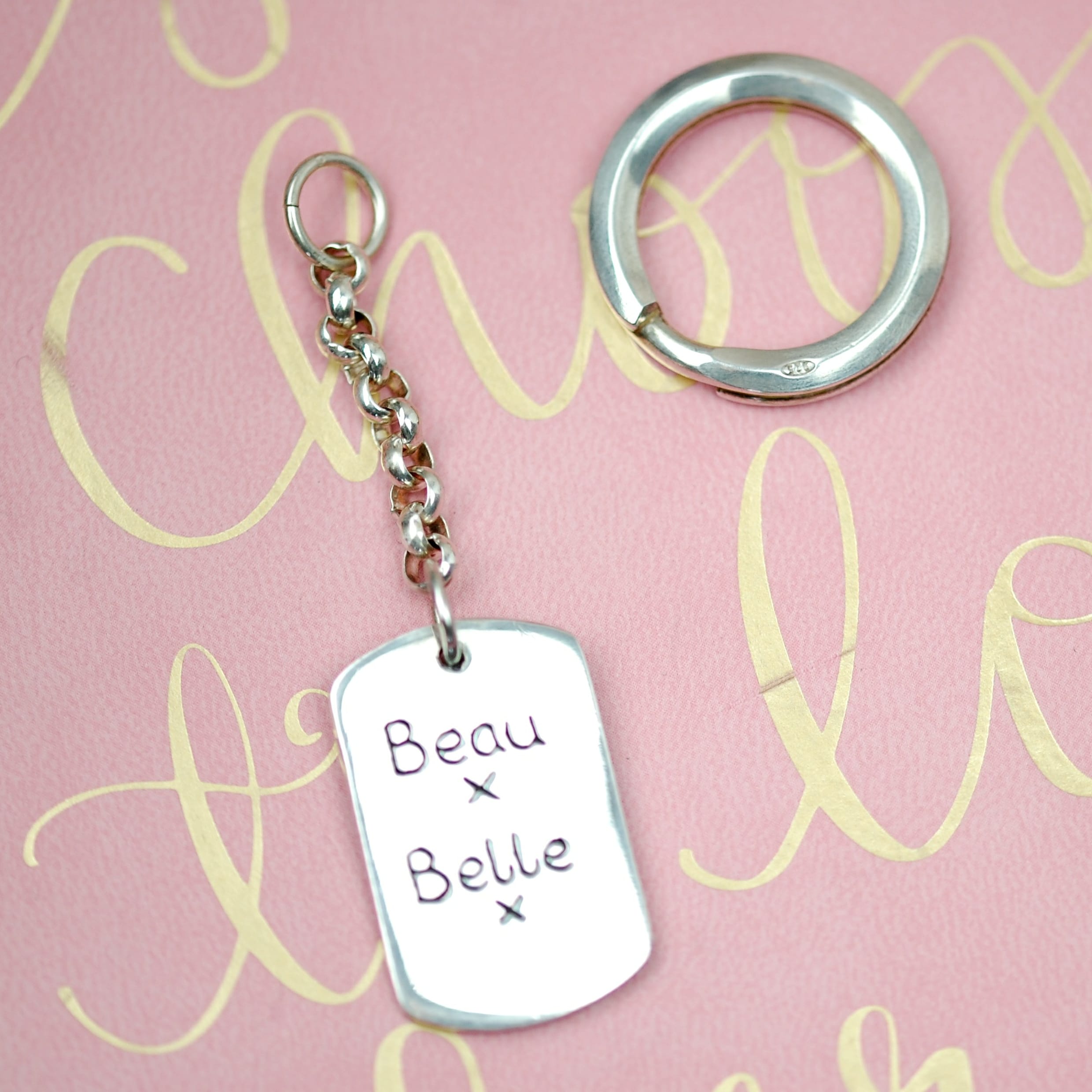 Inscription on the back of a large paw print keyring