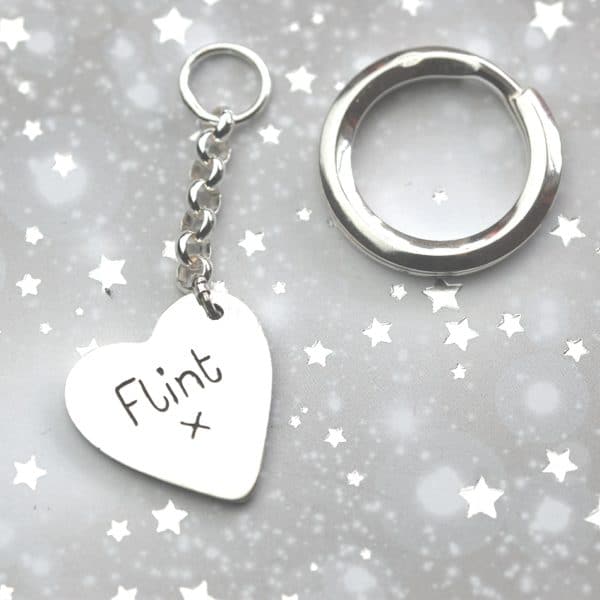 Inscription on the back of a regular silver paw print keyring