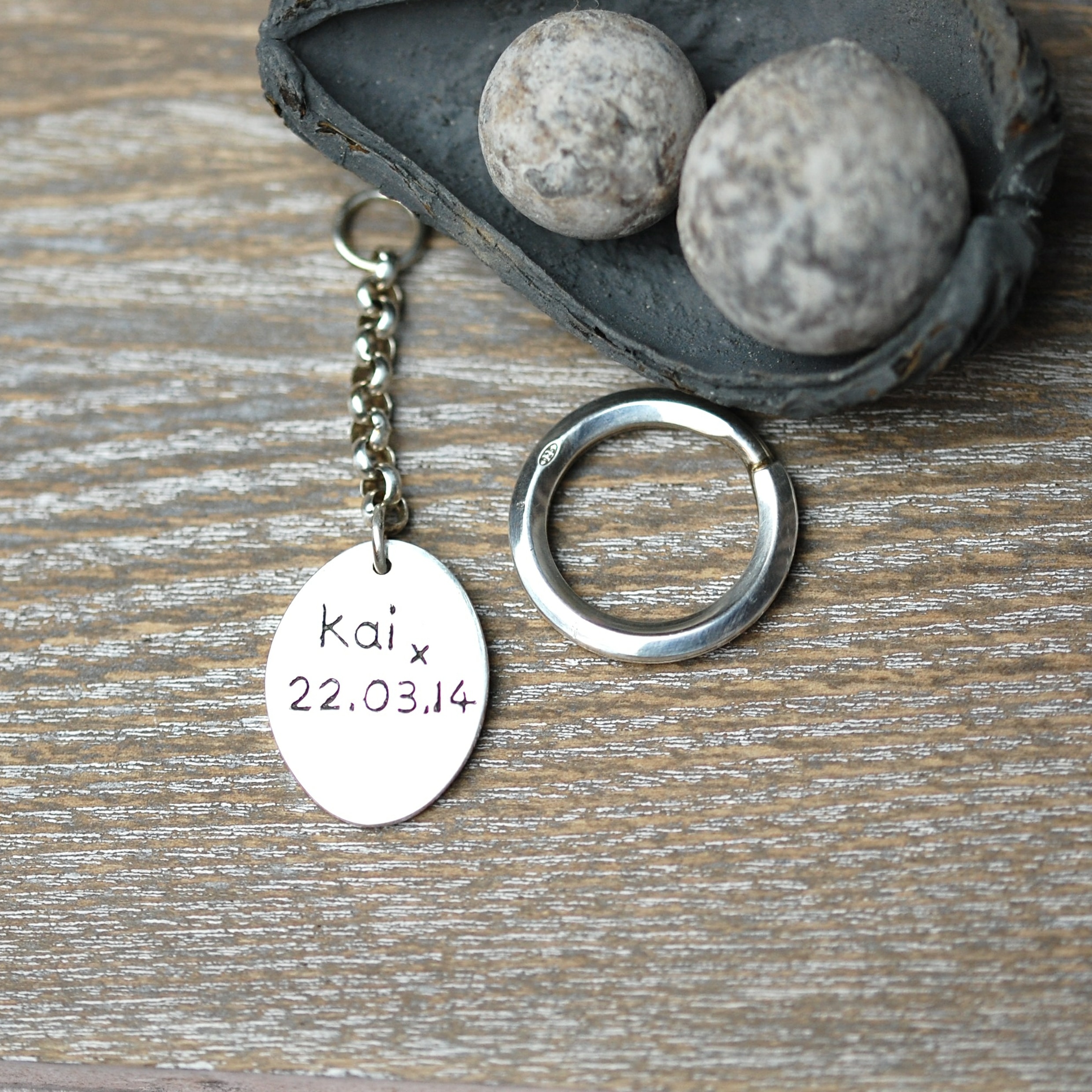 Inscription on the back of a regular silver paw print keyring