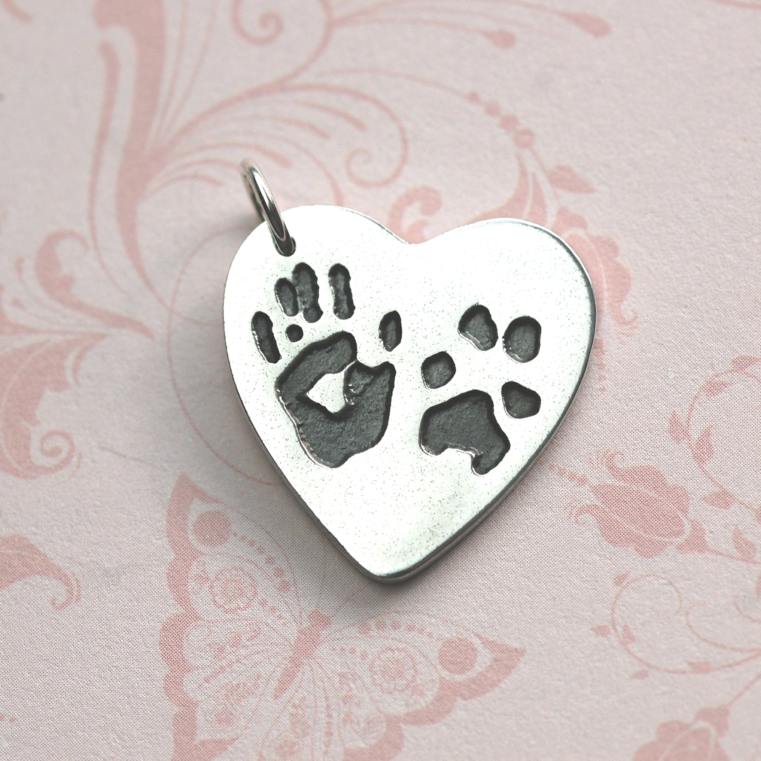 Large silver heart with unique hand and paw prints and names