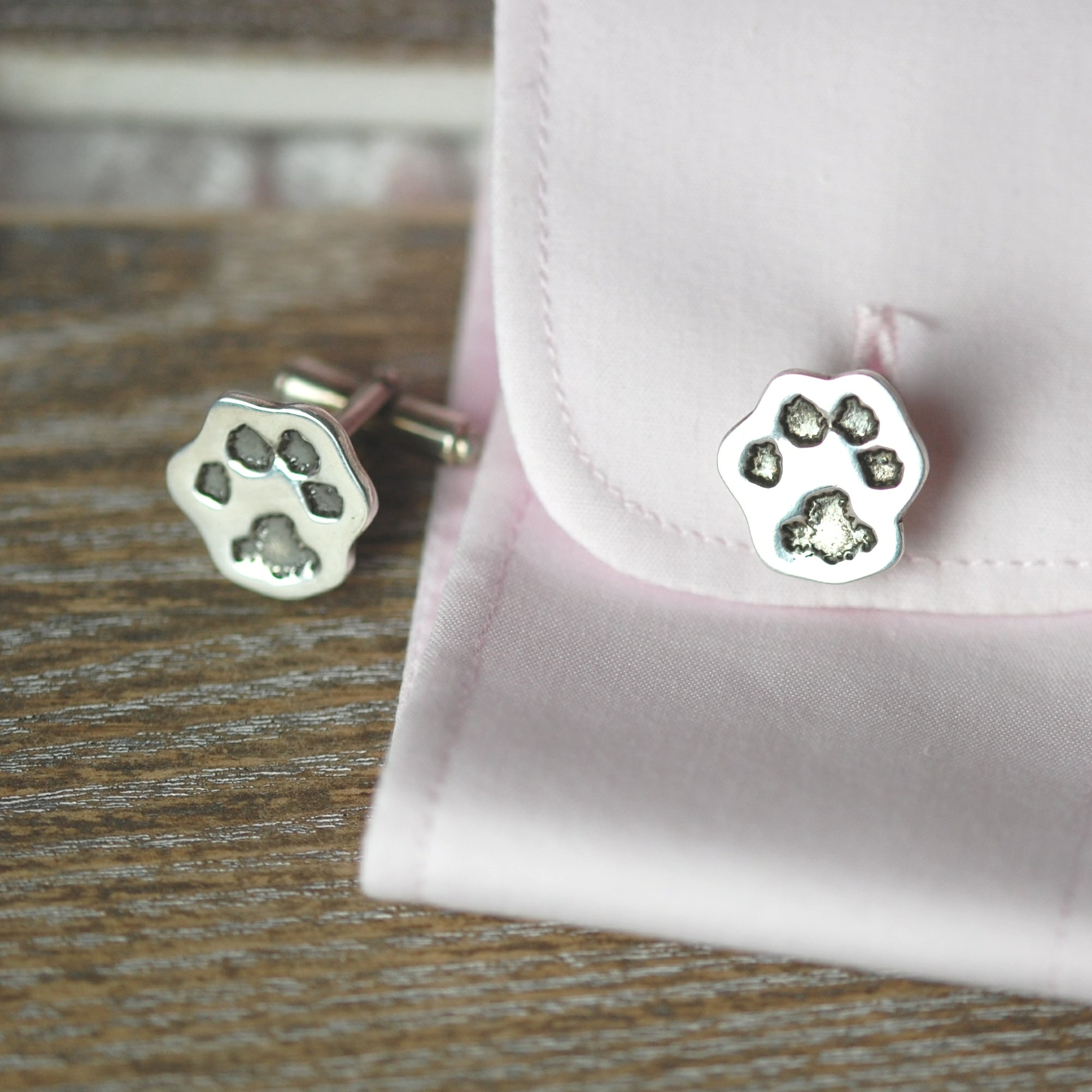 Sterling silver cut out paw print cufflinks