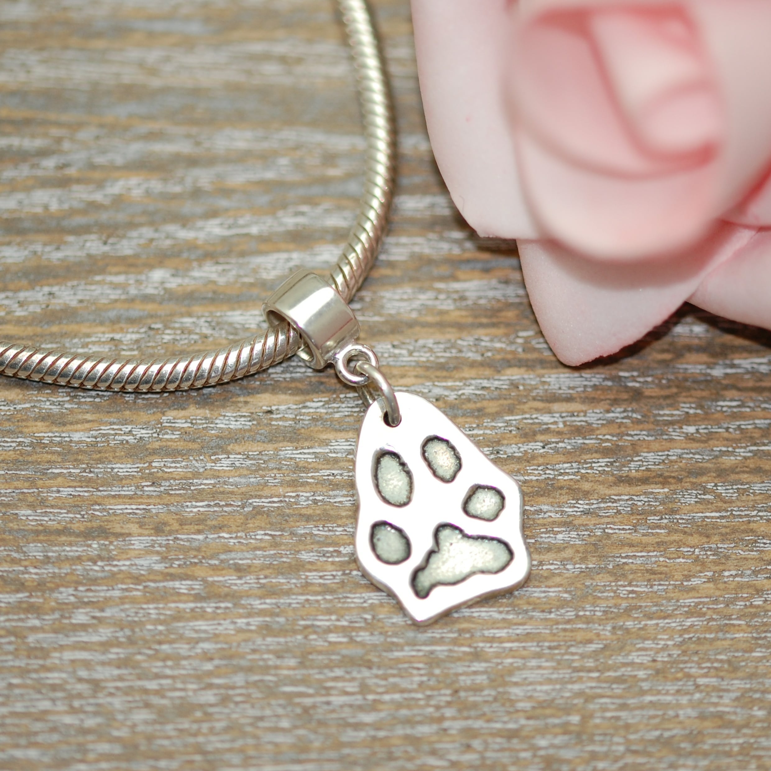 Regular silver paw print charm with charm carrier