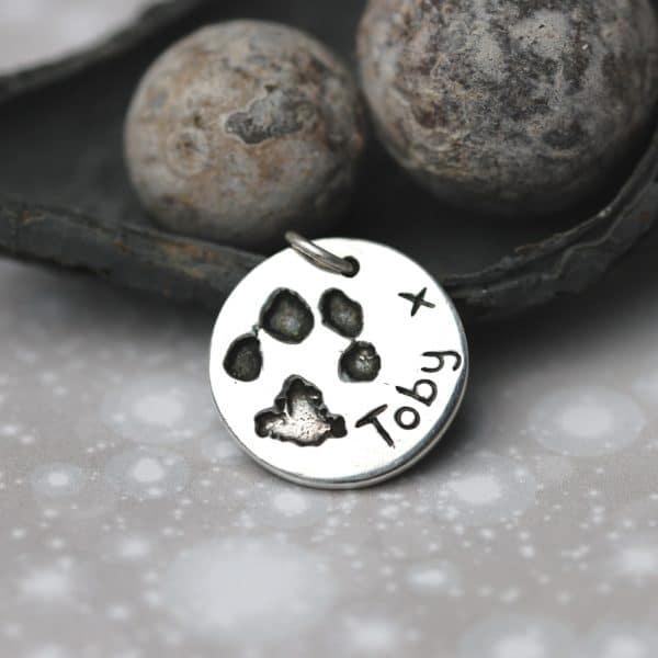 Sterling silver circle charm with your pet's uniuque paw print
