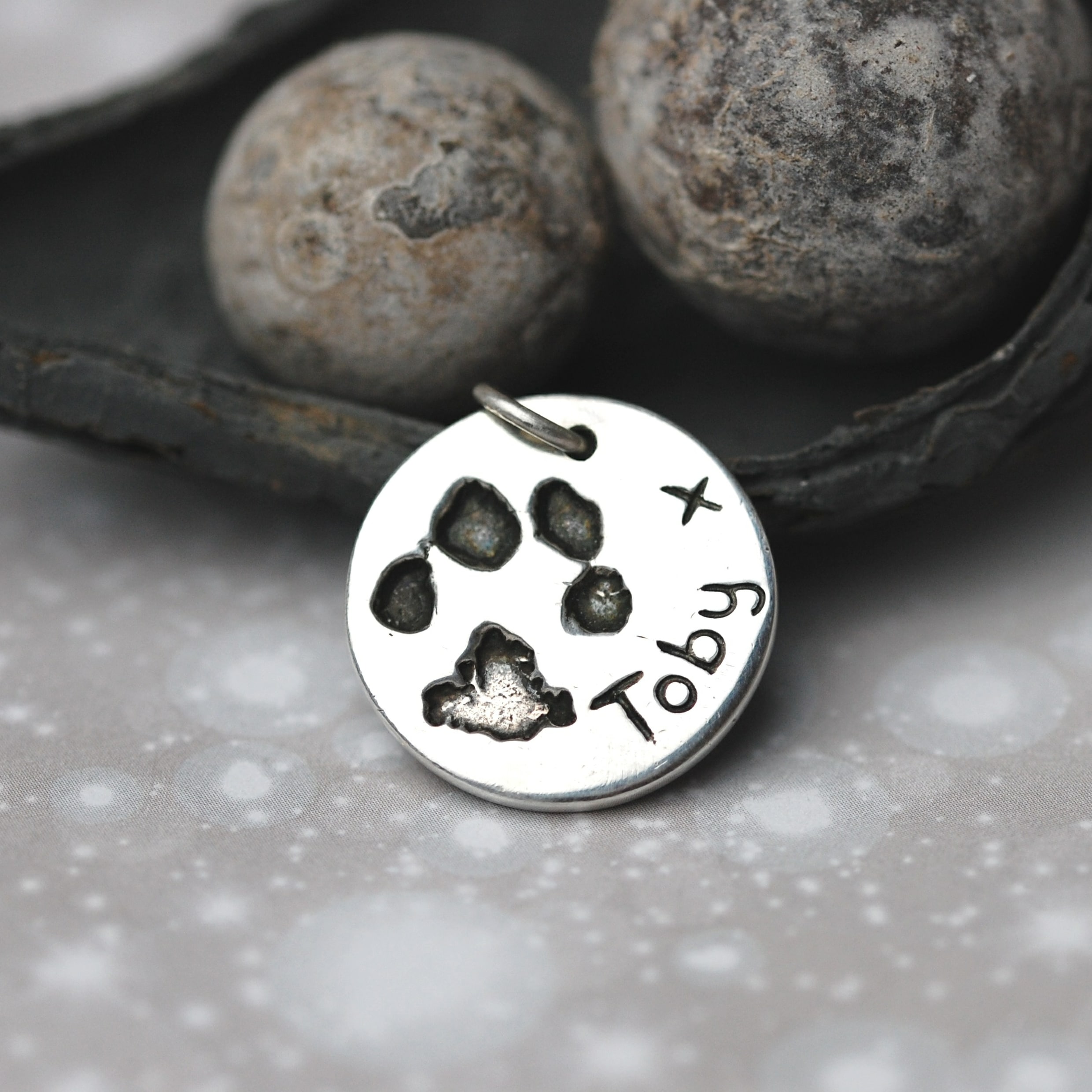 Sterling silver circle charm with your pet's uniuque paw print