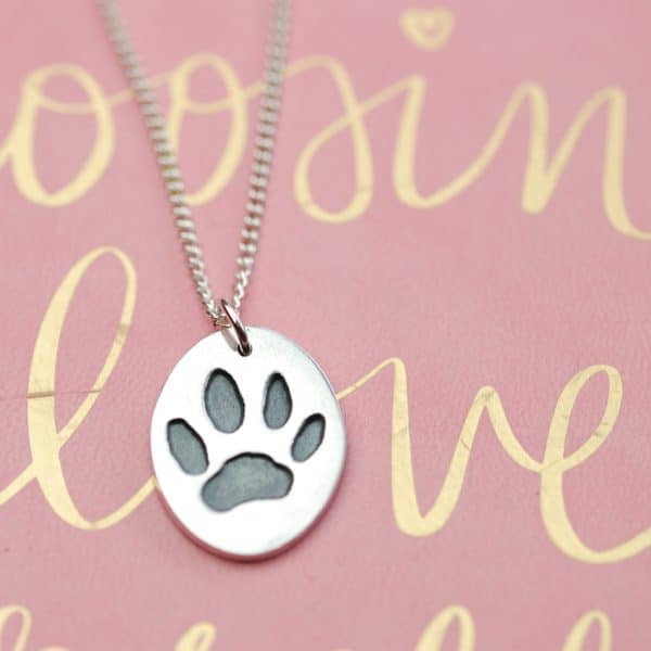 Regular sterling silver oval paw print charm