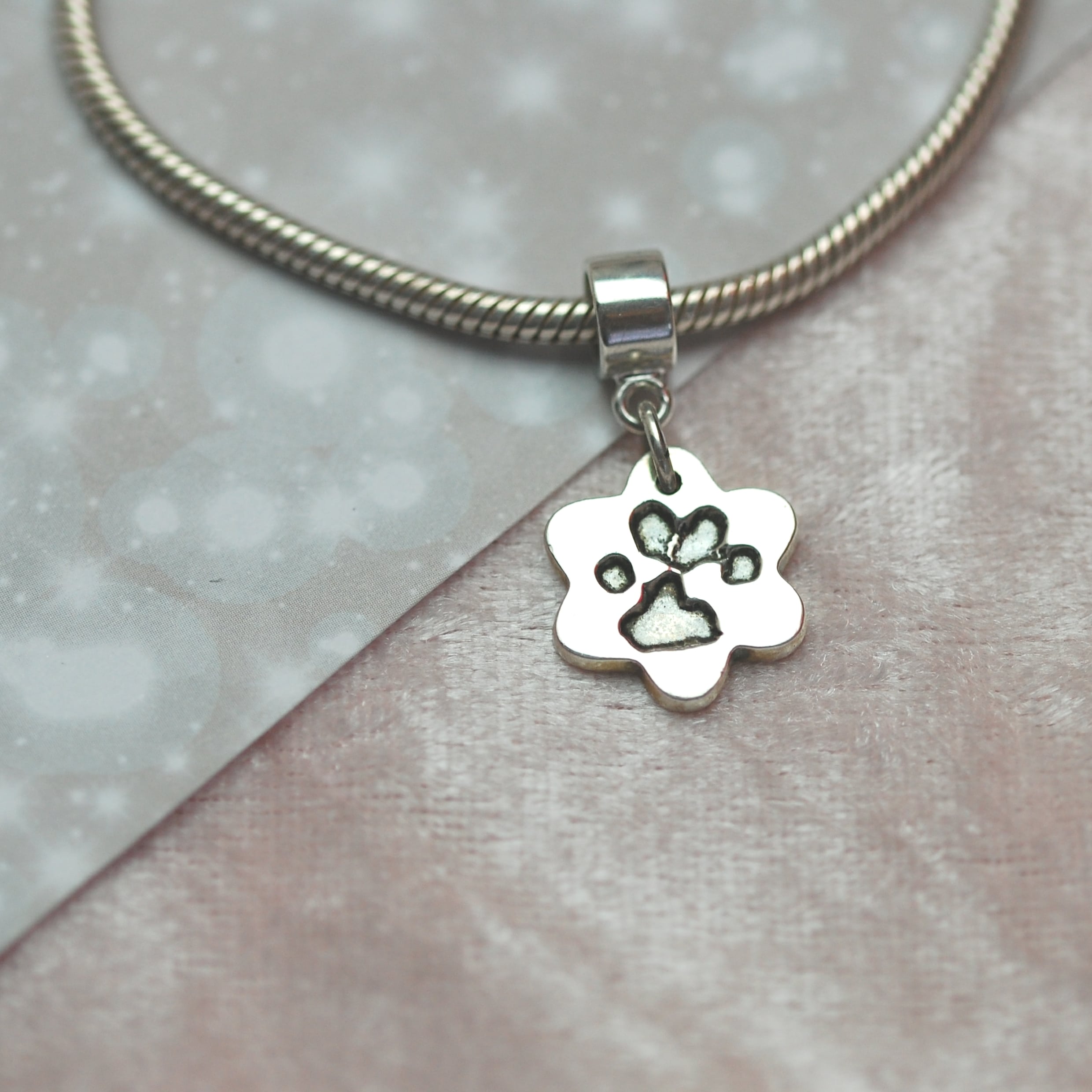 Small silver flower paw print charm with charm carrier