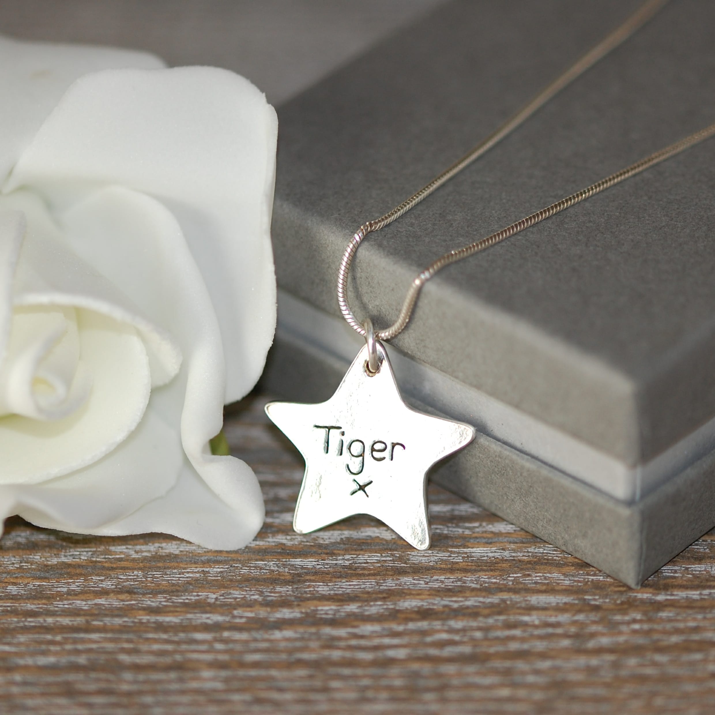 Inscription on the back of raised paw print charm