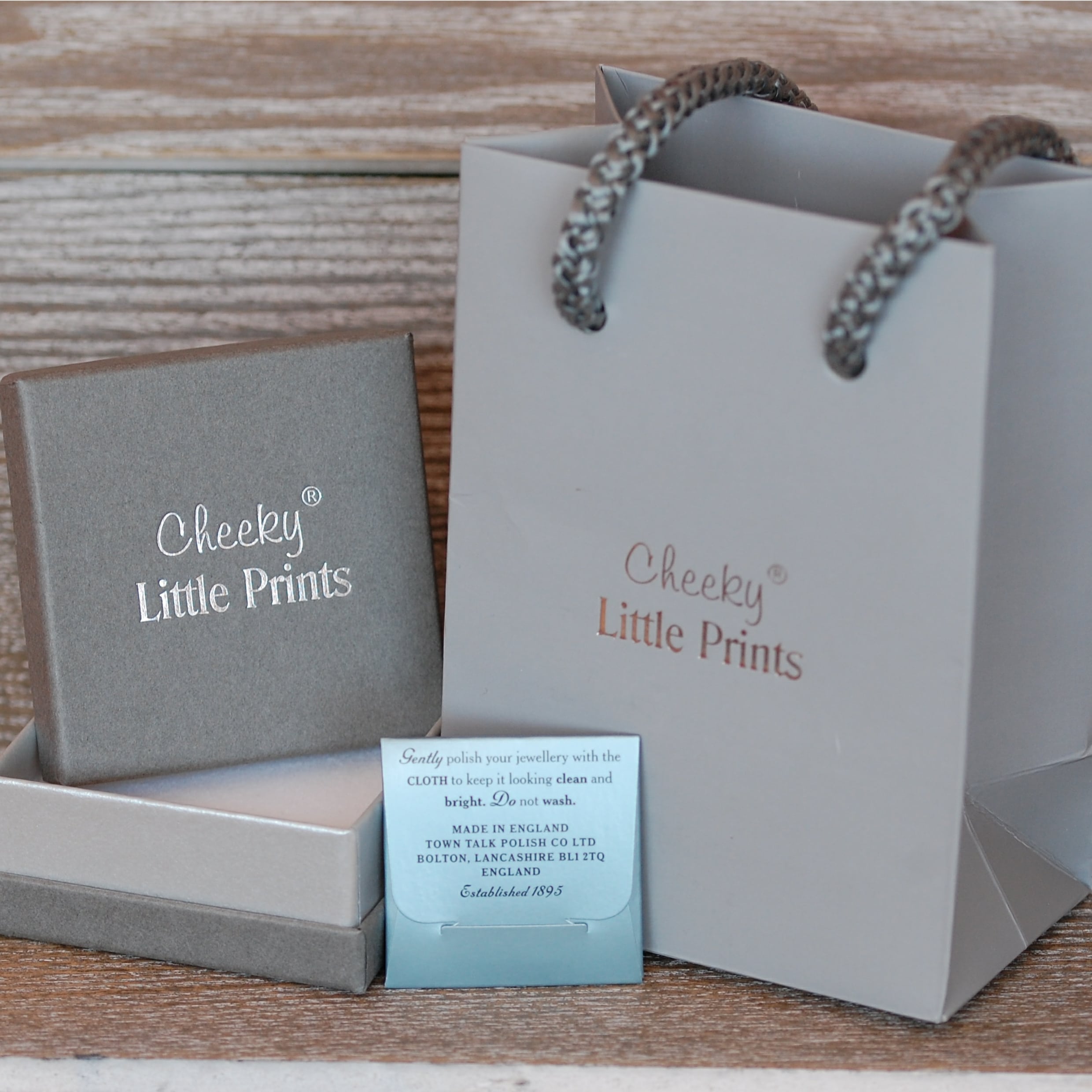 Stunning grey and silver jewellery packaging and polishing cloth to help care for your jewellery