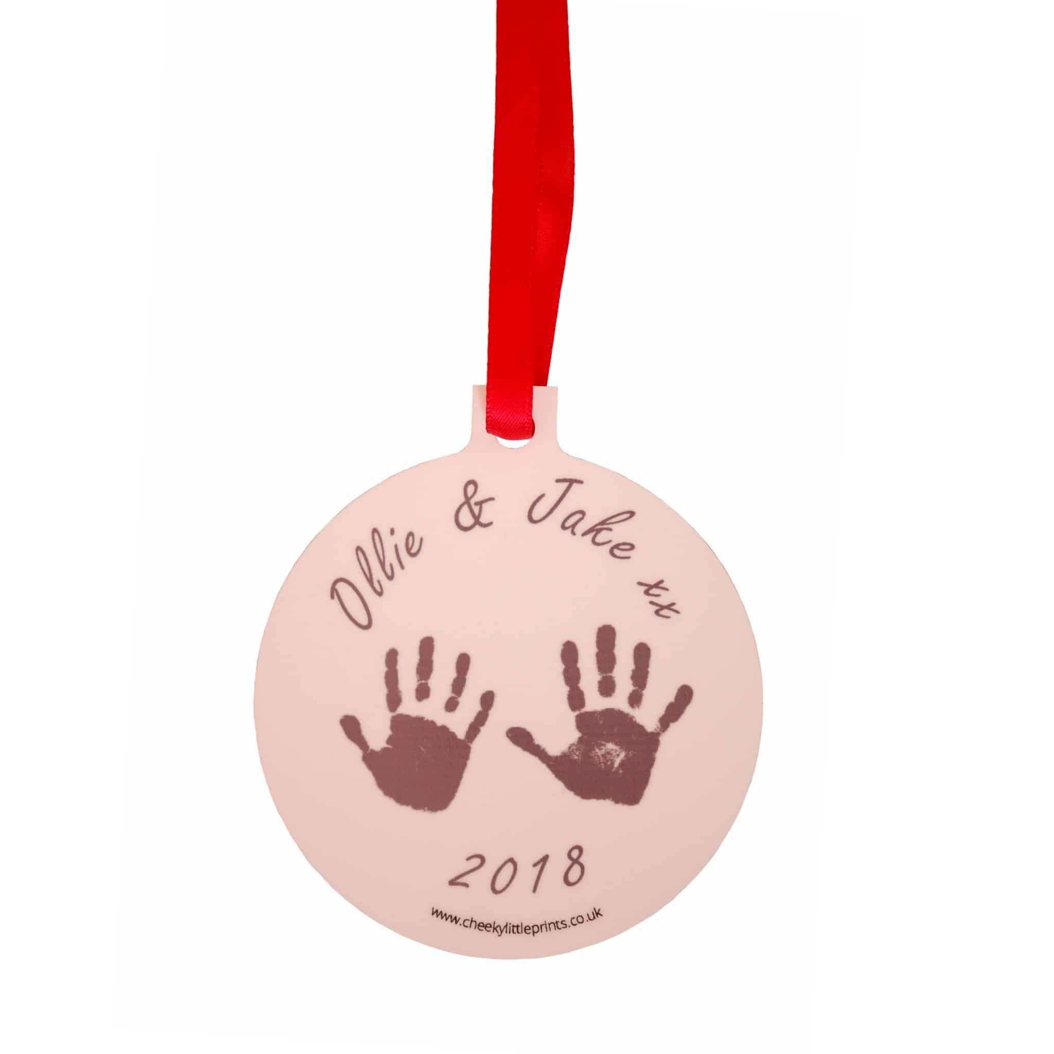 Christmas ornament personalised with sibling handprints