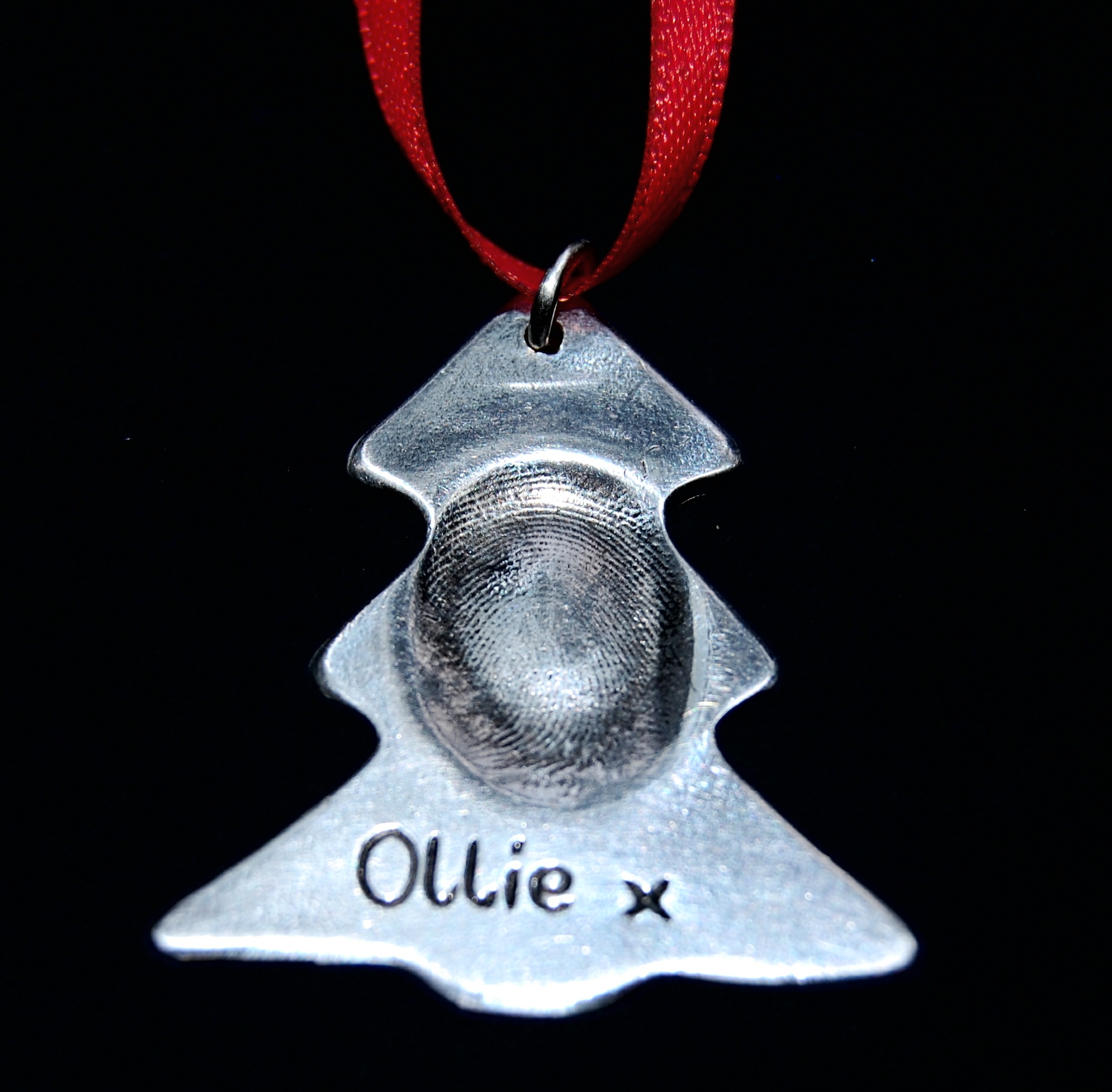 Stunning silver Christmas tree fingerprint charm. Presented on red ribbon, ready to hang on your tree.