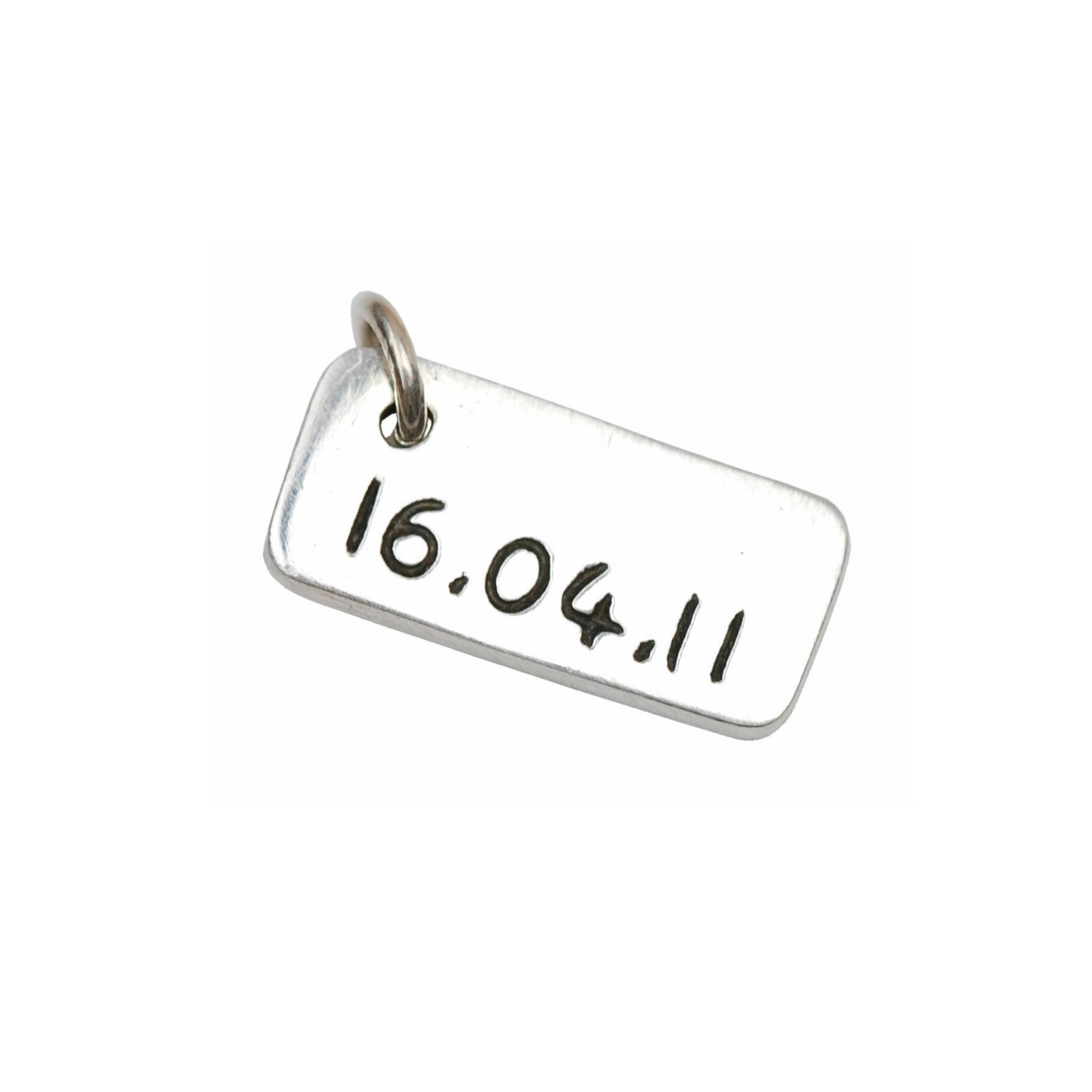 Inscription on the back of a signature charm