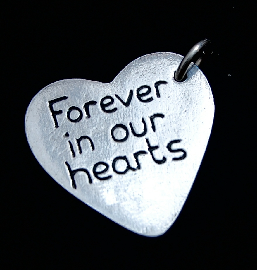 Have your own special message hand inscribed on the back of your charm.