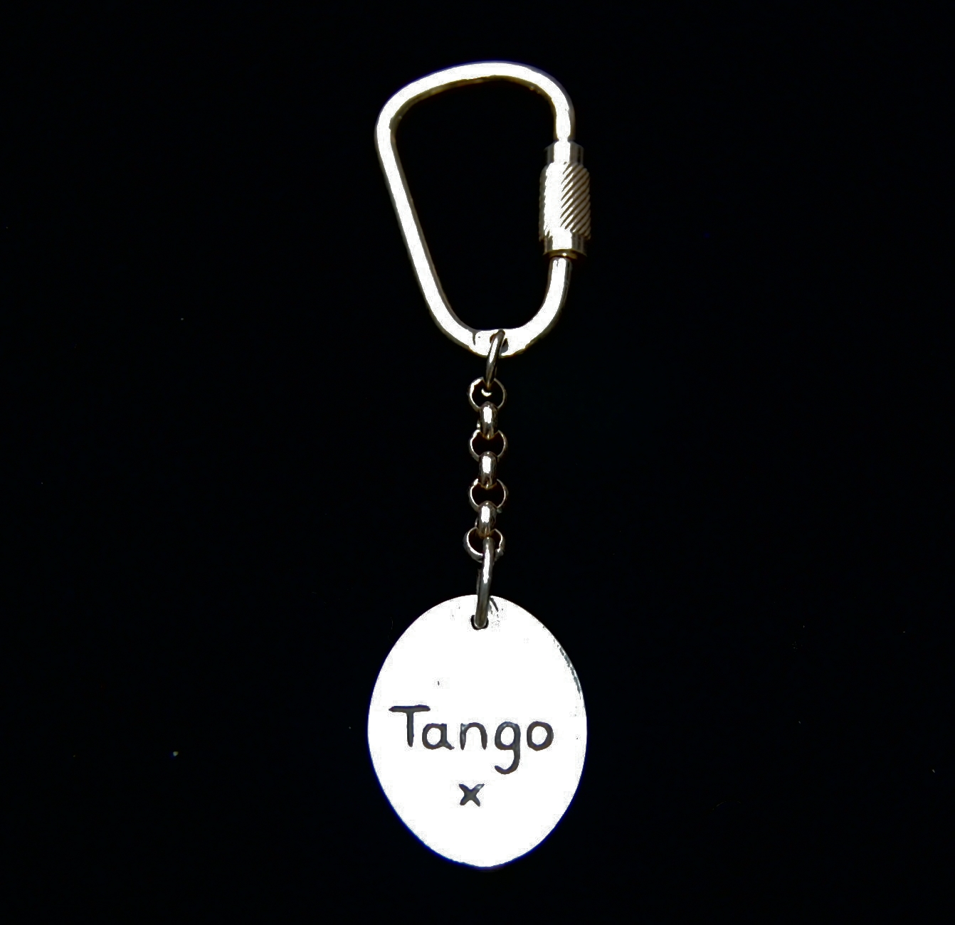 Name hand inscribed on the back of an oval horse shoe keyring.