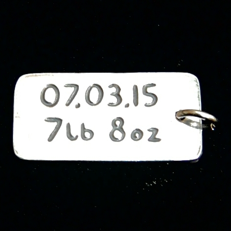 Have your own special date or information hand inscribed on the back of your charm.