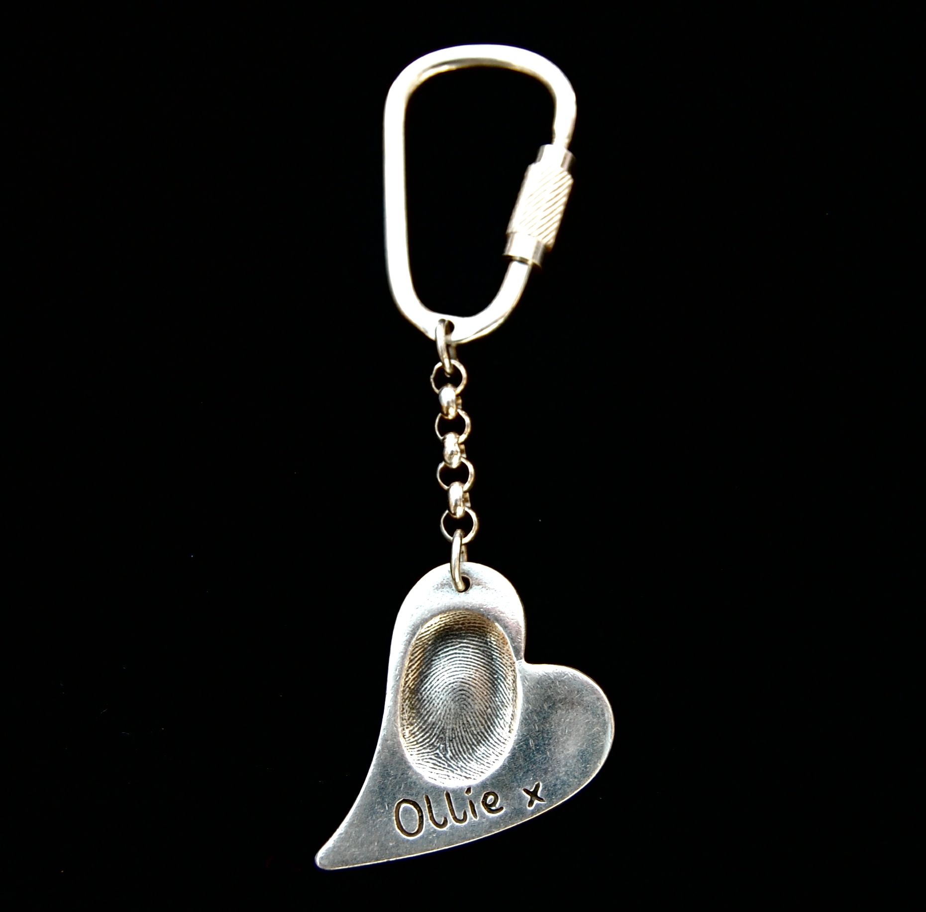 Large curved heart shaped silver fingerprint keyring with sterling silver keyring attachment.