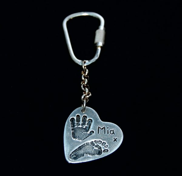 Large silver heart hand and footprint keyring with name hand inscribed on the front.
