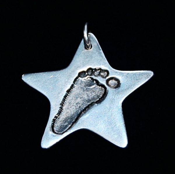 Regular silver star footprint charm. Name hand inscribed on the back.