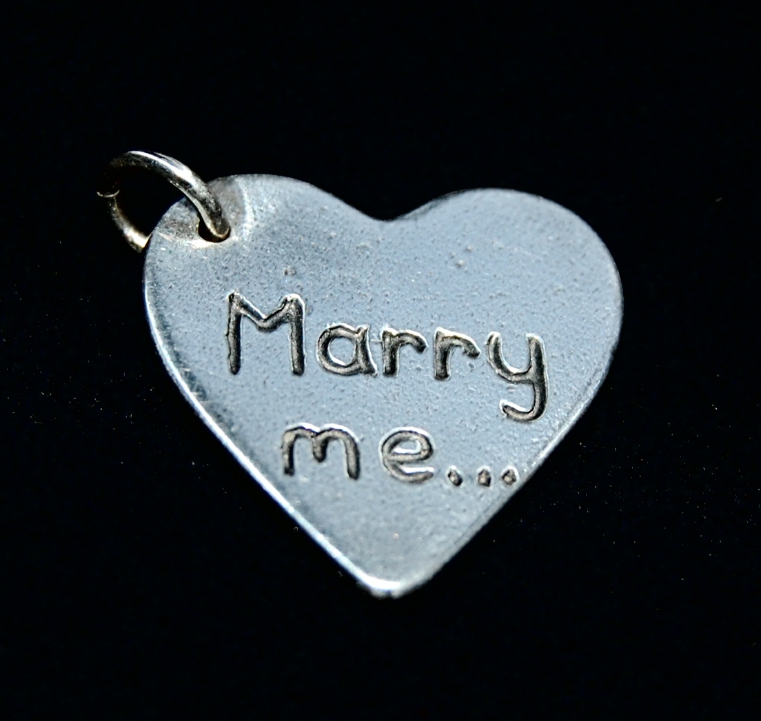 Regular silver heart charm inscribed with your special message.