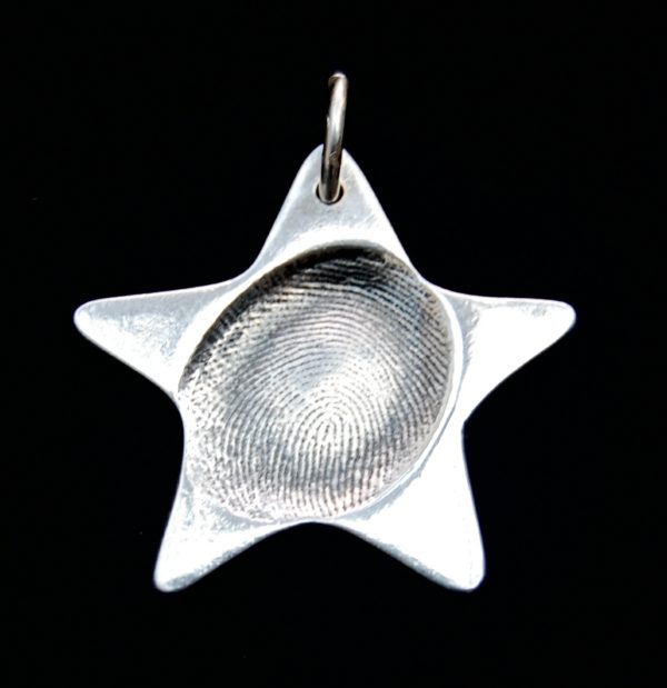 Regular star shaped silver fingerprint charm with name inscribed on the back.