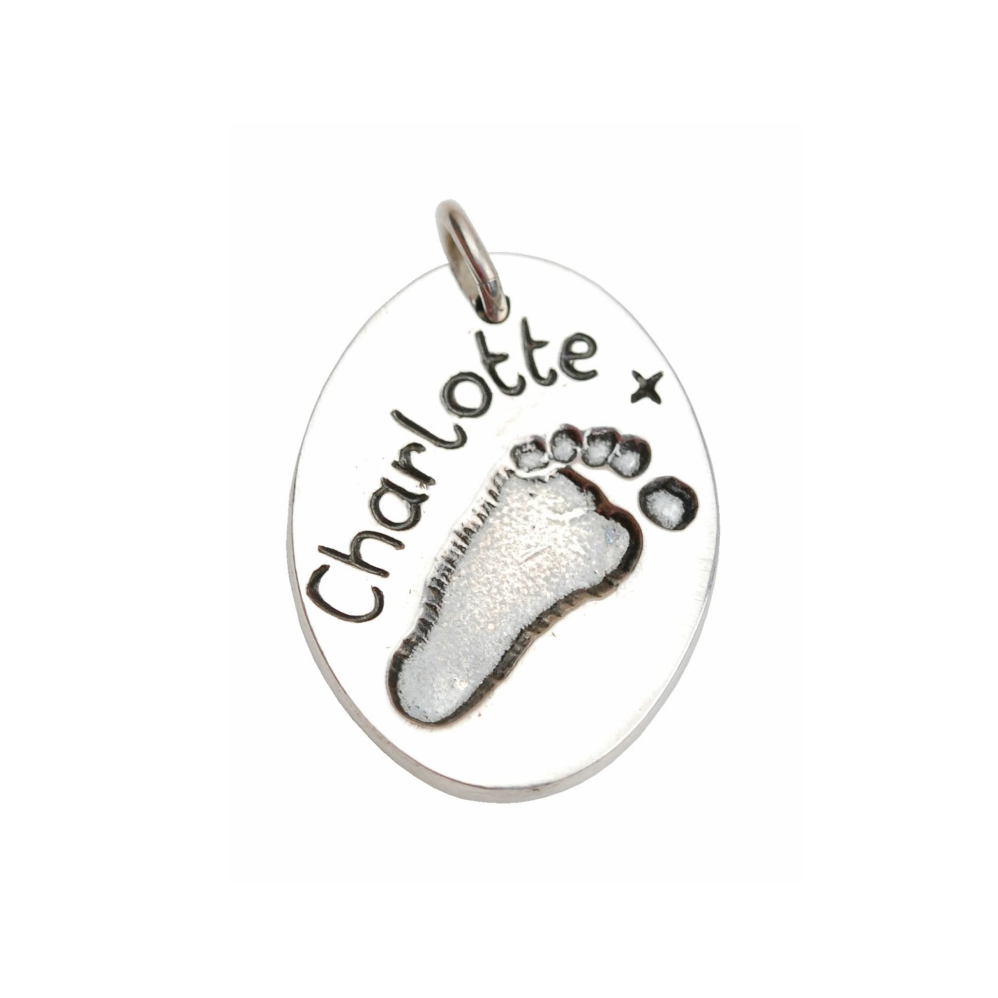 Silver oval charm with footprint