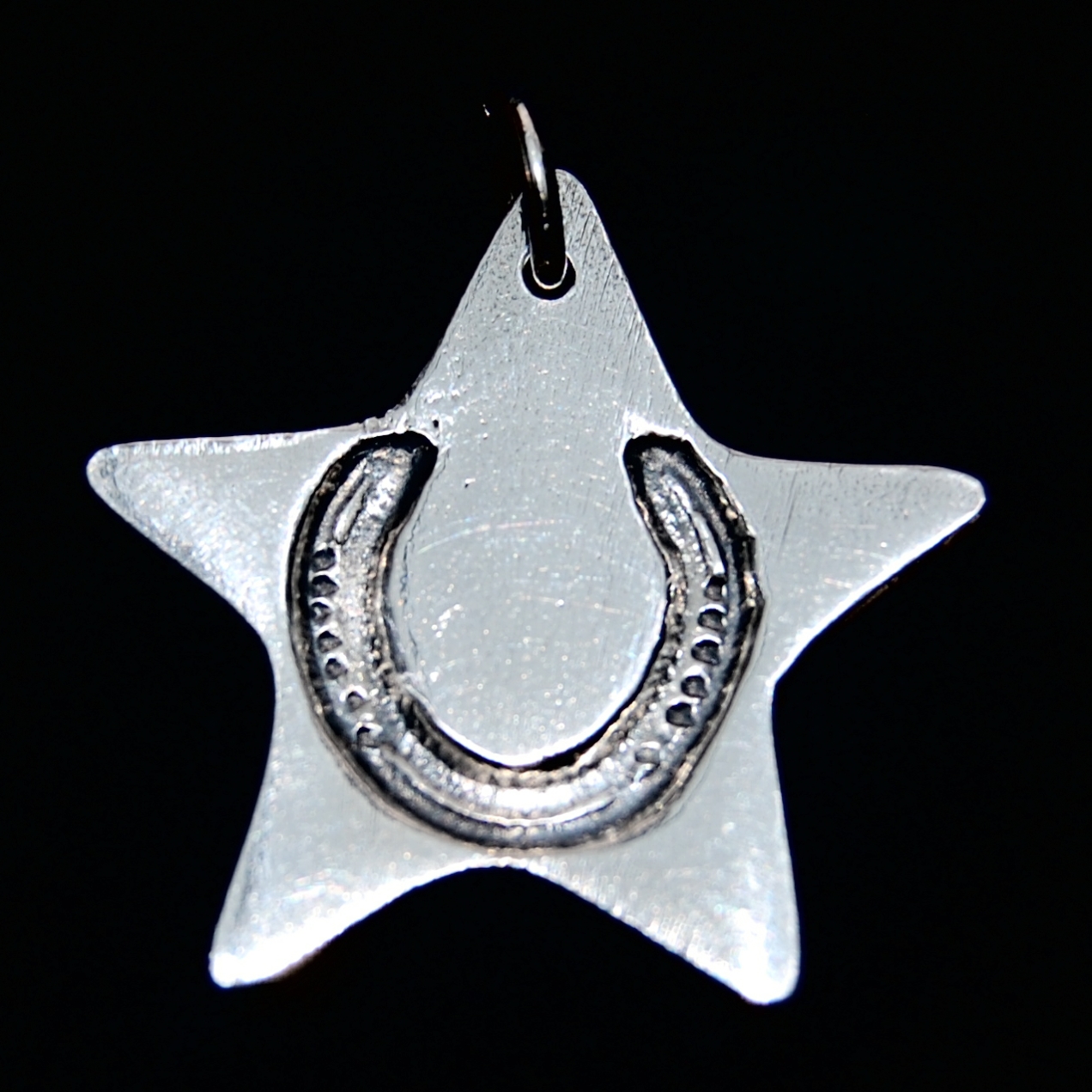 Regular silver star charm with your horse's unique shoe imprint.