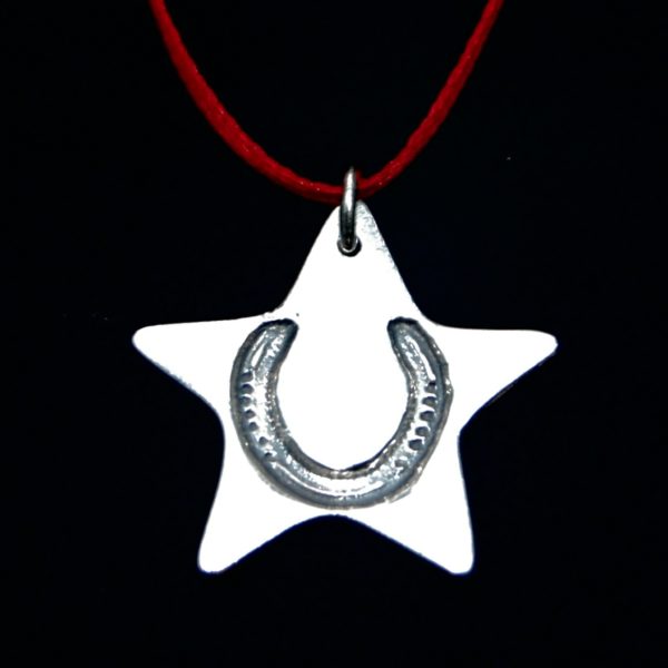 Silver star Christmas charm with your horse's unique shoe imprint. Presented on festive red ribbon ready to hang.