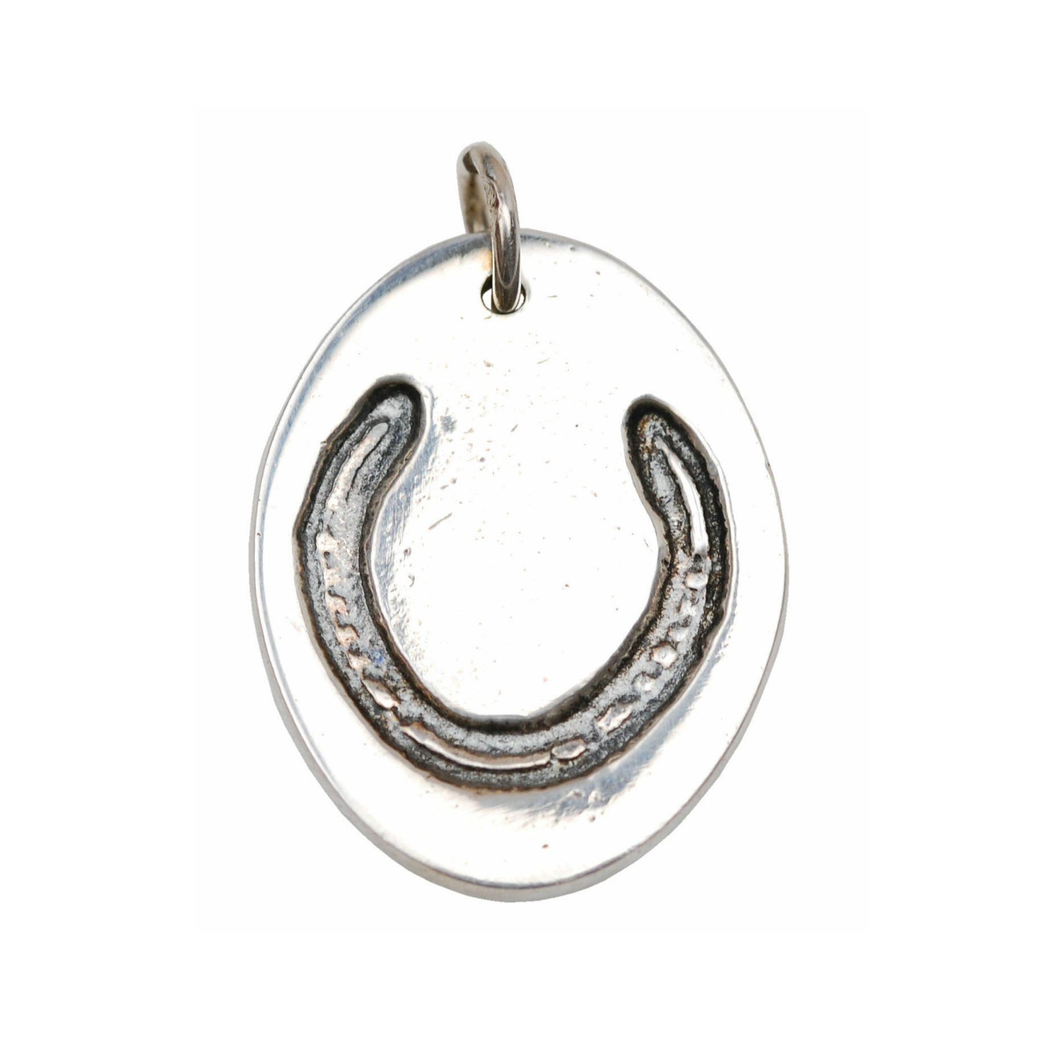 Silver oval charm with your own horse's shoe.