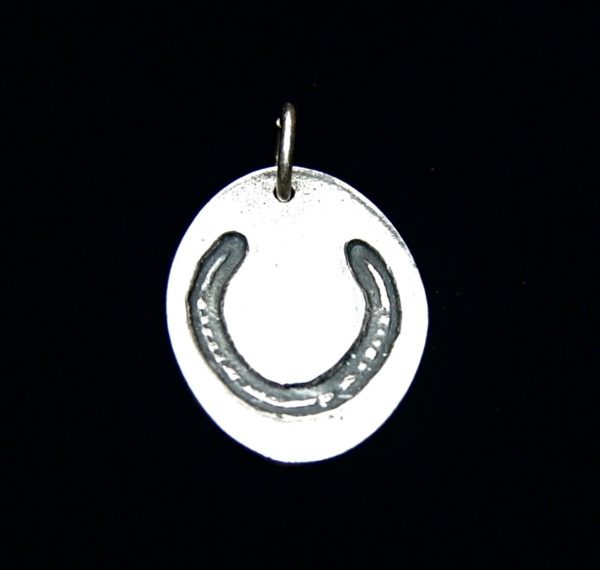 Regular silver oval charm with your horse's unique shoe imprint.
