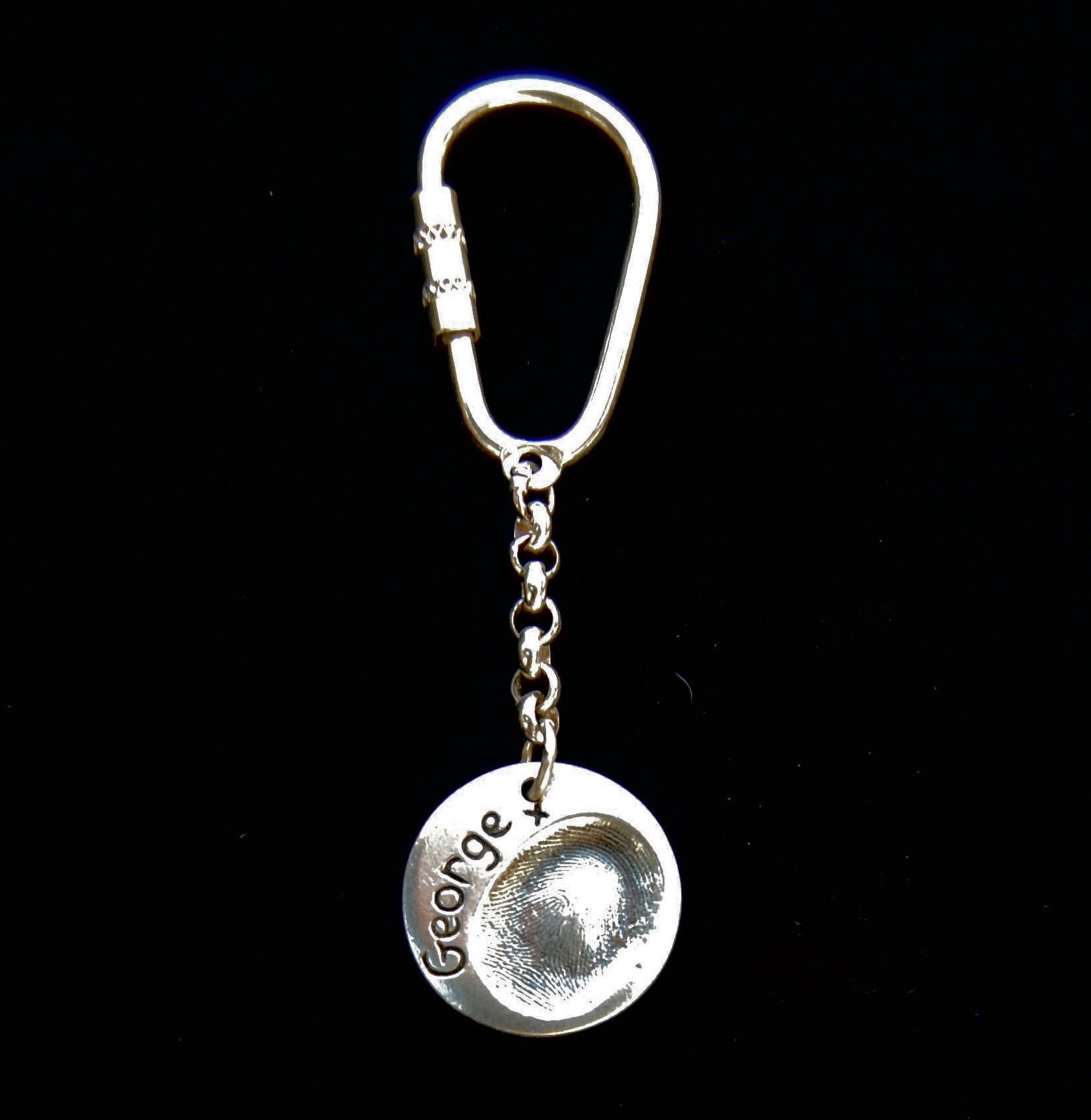 Silver oval keyring with personalised message hand inscribed in the silver.