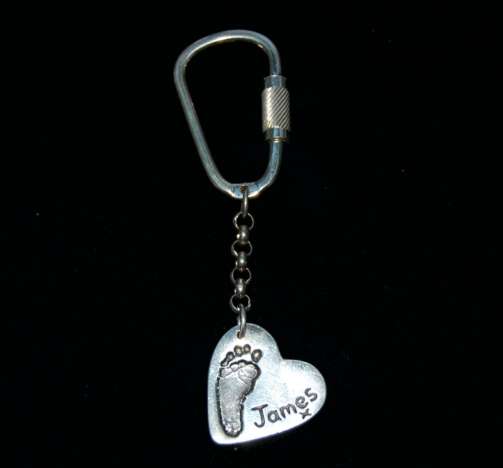 Regular silver heart keyring with footprint and name hand inscribed alongside the print.