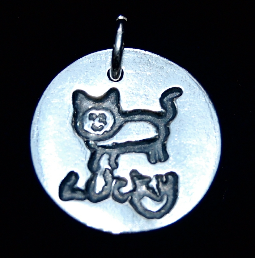 Small silver circle charm showcasing your child's drawing and writing.