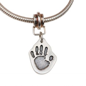 Small handprint cut out charm and charm carrier