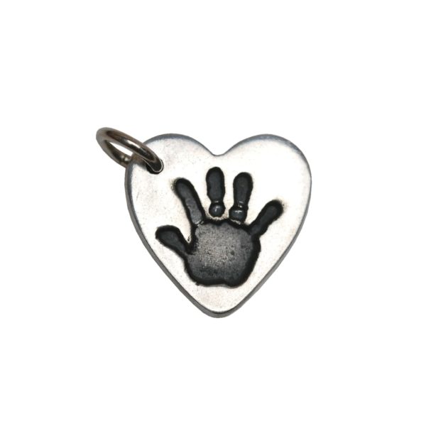 Silver heart charm with handprint
