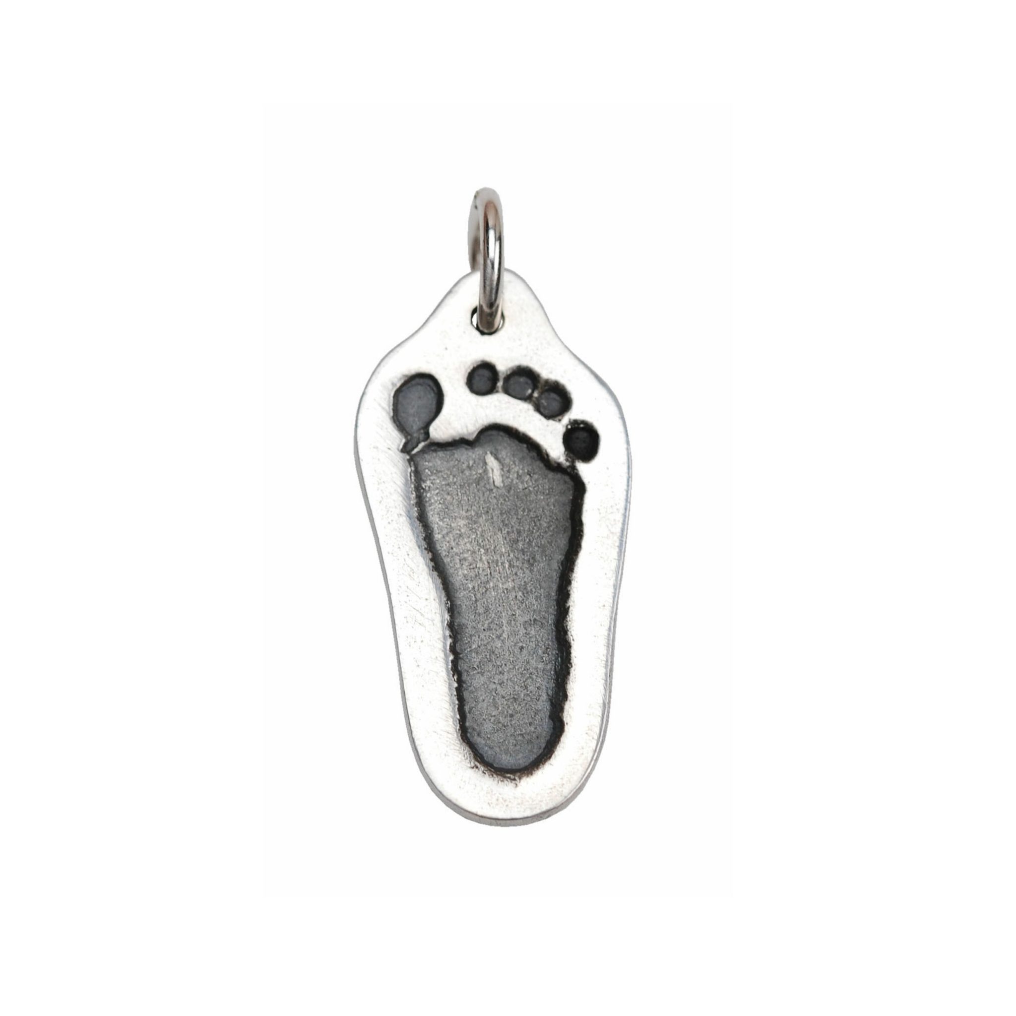 Silver cut out charm with footprint