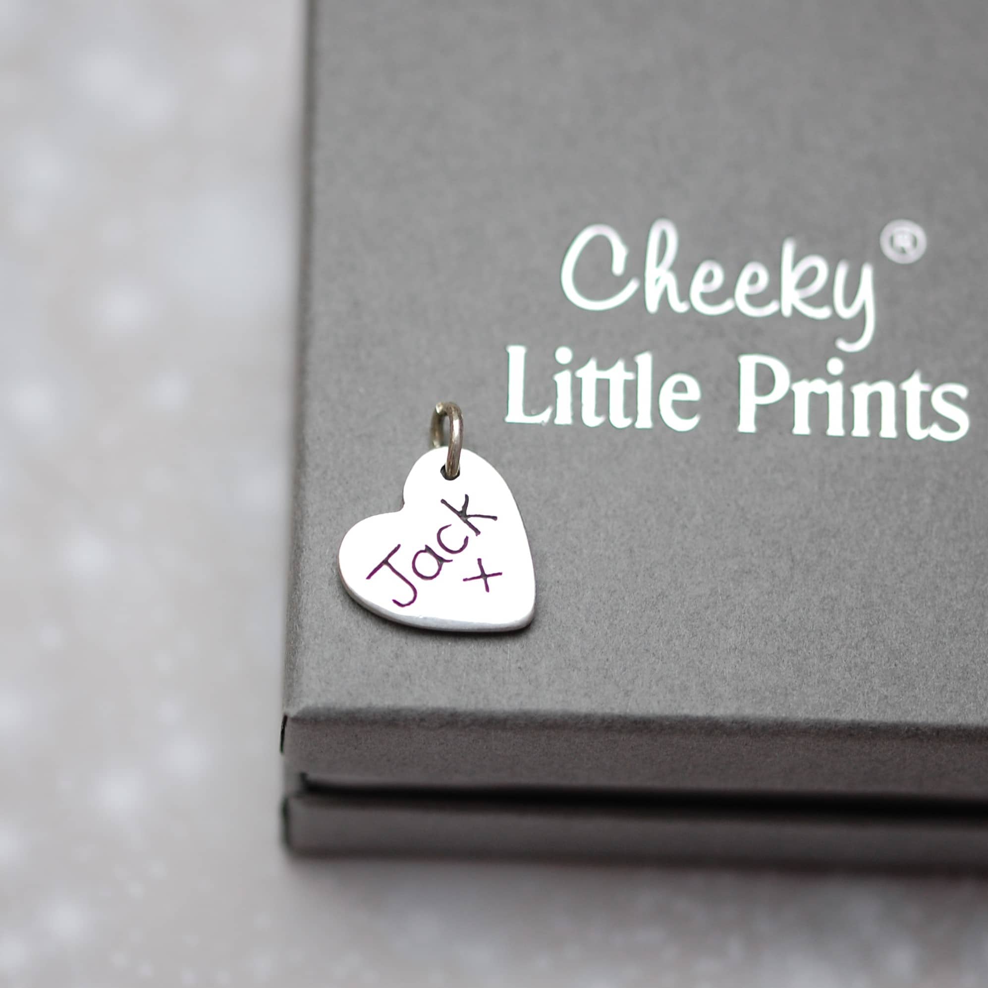 Inscription on the back of paw pad print charm