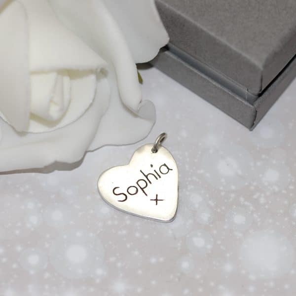 Inscription on back of silver paw pad charm