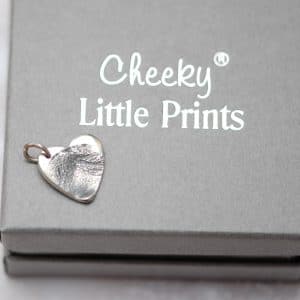 Small silver paw pad print charm