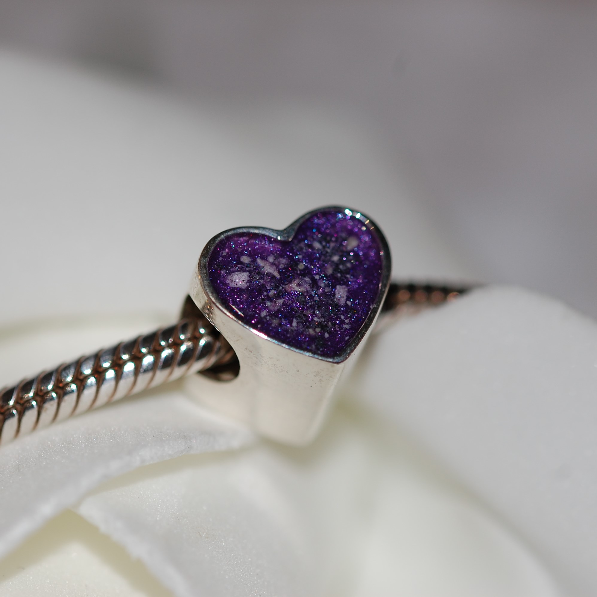 Silver heart charm bead with pet cremation ashes and violet colour
