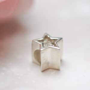 Star charm bead with pet fur or cremation ashes side view