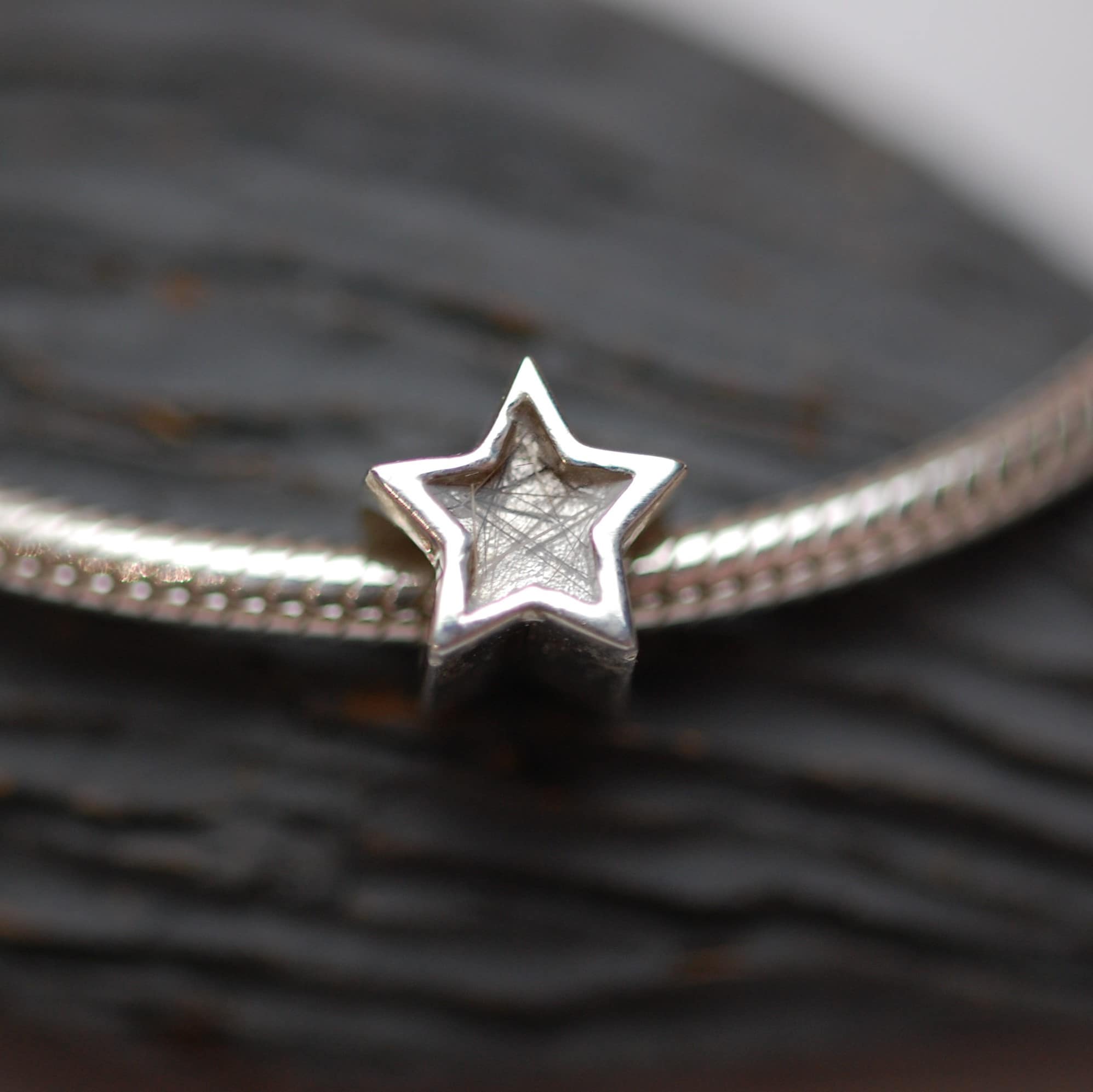 Silver star charm bead with pet fur or cremation ashes
