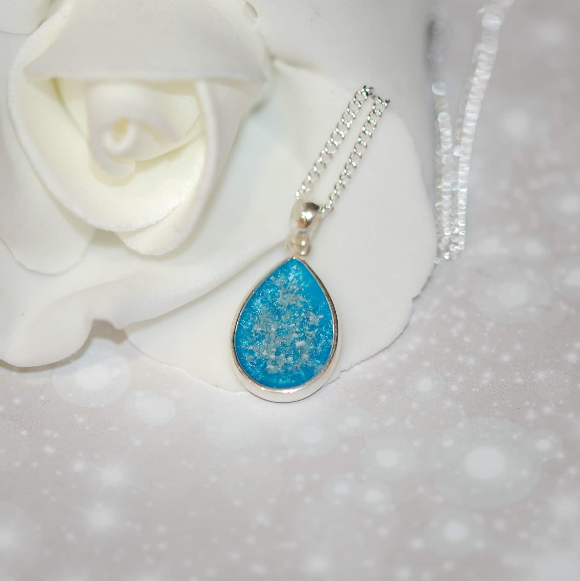 Silver tear drop pendant with pet fur or cremation ashes