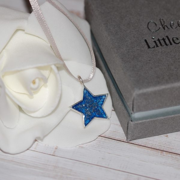 Silver star Christmas decoration with pet cremation ashes and blue resin