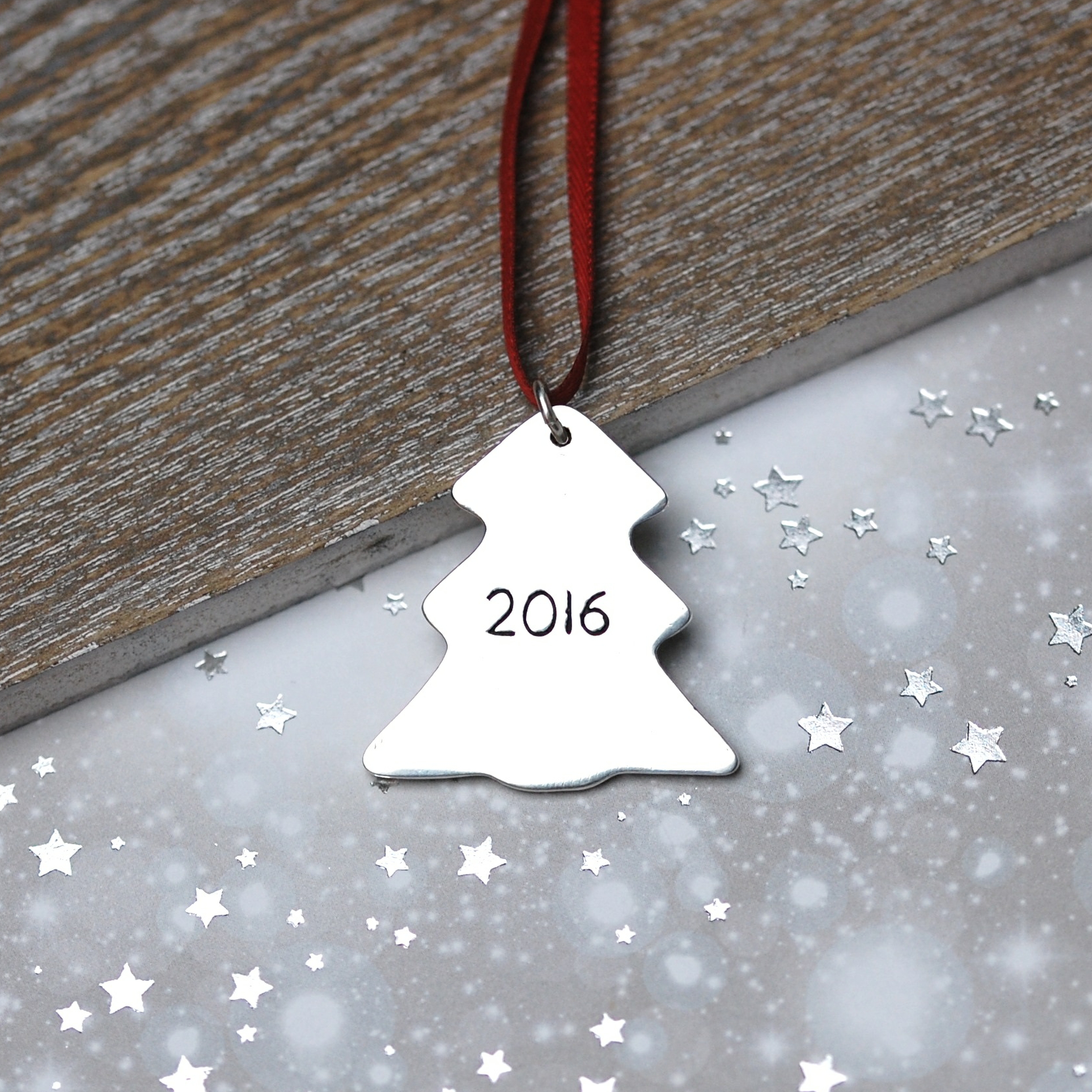 Date inscription on the back of a silver personalised Christmas decoration
